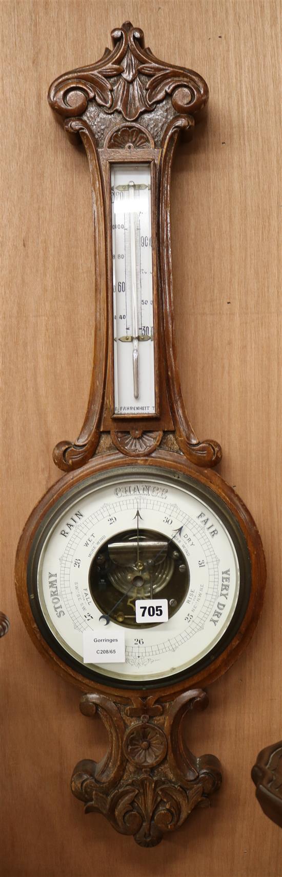 An Edwardian carved oak barometer and thermometer W.25cm